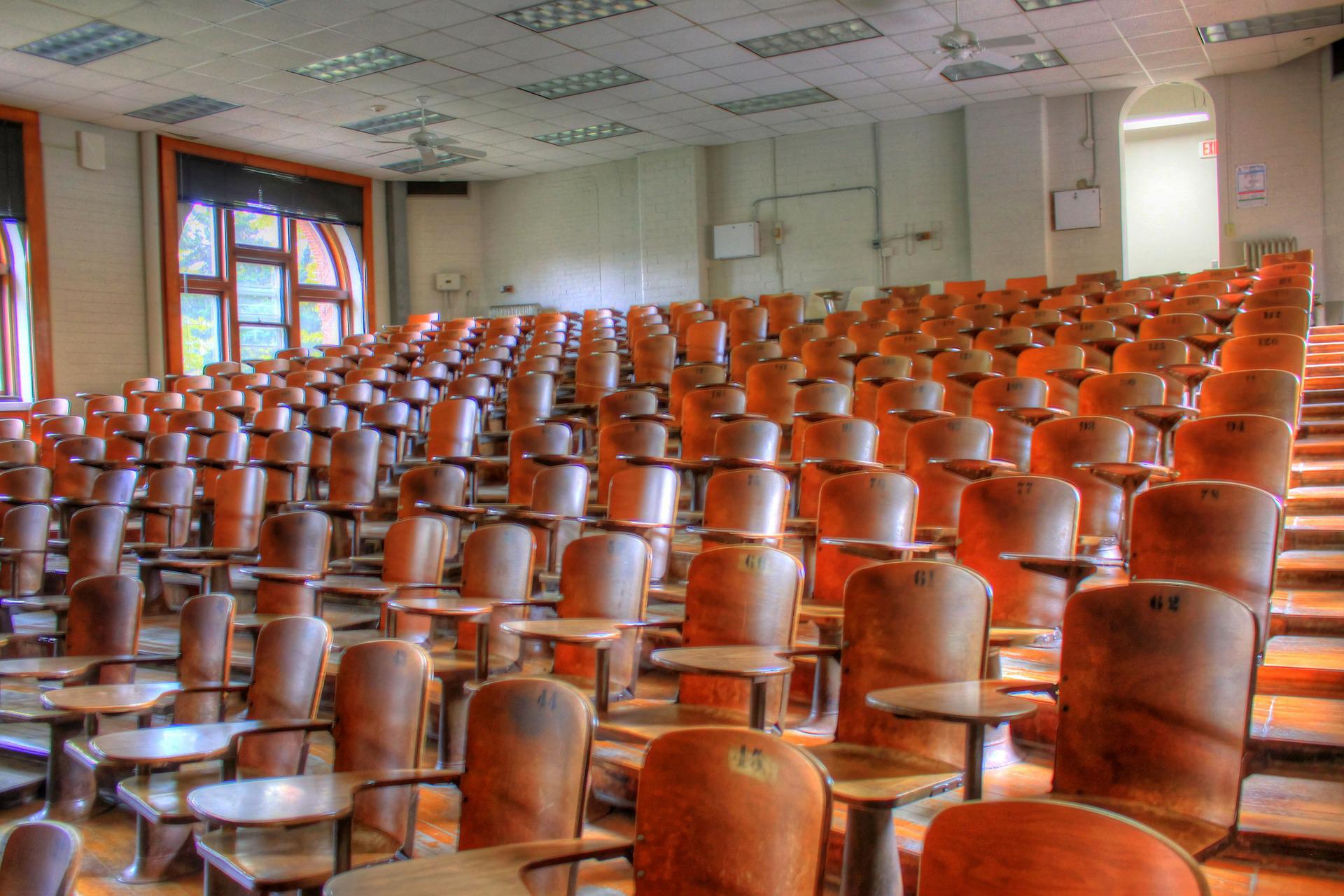 a set of empty seats in a lecture hall